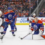 Jan 23, 2024; Edmonton, Alberta, CAN; Edmonton Oilers goaltender Stuart Skinner (74) makes a save on a deflection by Columbus Blue Jackets forward Dmitri Voronkov (10) during the second period at Rogers Place.