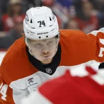 Oct 15, 2026; Detroit, Michigan, USA; Philadelphia Flyers right wing Owen Tippett (74) gets set during a face off in the first period against the Detroit Red Wings at Little Caesars Arena.