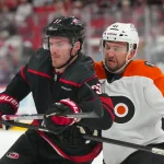 May 2, 2026; Raleigh, North Carolina, USA; Carolina Hurricanes right wing Andrei Svechnikov (37) and Philadelphia Flyers center Luke Glendening (41) battle during the first period at Lenovo Center.