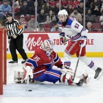 6 janvier 2024 ; Montréal, Québec, CAN ; le gardien des Canadiens de Montréal, Sam Montembeault (35), arrête l'attaquant des Rangers de New York, Mika Zibanejad (93), lors de la séance de tirs au but au Centre Bell.