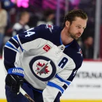 Sep 25, 2026; Denver, Colorado, USA; Winnipeg Jets defenseman Josh Morrissey (44) skates before the game against the Colorado Avalanche at Ball Arena.