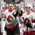 Apr 18, 2026; Raleigh, North Carolina, USA; Ottawa Senators defenseman Thomas Chabot (72) and center Tim Stützle (18) comes off the ice after the warmups before the game against the Carolina Hurricanes in game one of the first round of the 2026 Stanley Cup Playoffs at Lenovo Center.