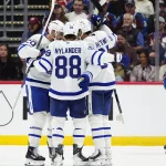 Oct 10, 2026; Denver, Colorado, USA; Members of the Toronto Maple Leafs celebrate a goal scored in the second period against the Colorado Avalanche at Ball Arena.