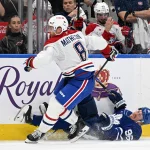 Sep 29, 2026; Toronto, Ontario, CAN; Montreal Canadiens defenseman Mike Matheson (8) bodychecks Toronto Maple Leafs forward Jack Roslovic (96) in the third period at Scotiabank Arena.