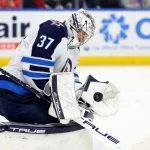 Dec 5, 2024; Buffalo, New York, USA; Winnipeg Jets goaltender Connor Hellebuyck (37) makes a save during the second period against the Buffalo Sabres at KeyBank Center.