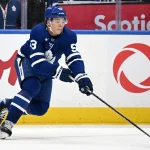Oct 19, 2026; Toronto, Ontario, CAN; Toronto Maple Leafs forward Easton Cowan (53) reaches to take in a pass against the San Jose Sharks in the second period at Scotiabank Arena.