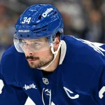 Oct 19, 2026; Toronto, Ontario, CAN; Toronto Maple Leafs forward Auston Matthews (34) prepares to take a faceoff against the San Jose Sharks in the first period at Scotiabank Arena.