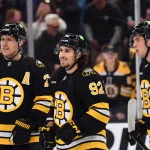 Oct 10, 2026; Boston, Massachusetts, USA; Boston Bruins center Marat Khusnutdinov (92) with defenseman Hampus Lindholm (27) and right wing JJ Peterka (10) after scoring a goal during the third period against the Philadelphia Flyers at TD Garden.