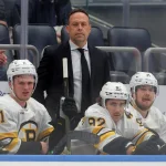 Nov 4, 2025; Elmont, New York, USA; Boston Bruins head coach Marco Sturm coaches against the New York Islanders during the first period at UBS Arena.