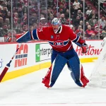 Oct 20, 2026; Montreal, Quebec, CAN; Montreal Canadiens goalie Jakub Dobes (75) intercepts the puck behind his net against the San Jose Sharks during the third period at Bell Centre.