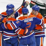 Oct 20, 2026; Edmonton, Alberta, CAN; The Edmonton Oilers celebrate a goal scored by defensemen Evan Bouchard (2) during overtime against the Minnesota Wild at Rogers Place.