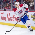 Sep 26, 2026; Ottawa, Ontario, CAN; Montreal Canadiens defenseman David Reinbacher (64) skates with the puck in the first period against the Ottawa Senators at the Canadian Tire Centre.