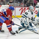 Feb 27, 2025; Montreal, Quebec, CAN; San Jose Sharks goalie Alexandar Georgiev (40) stops Montreal Canadiens forward Owen Beck (62) during the second period at the Bell Centre. Mandatory Credit: Eric Bolte-Imagn Images