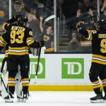 Sep 20, 2026; Boston, Massachusetts, USA; Boston Bruins goaltender Michael DiPietro (30), center Fraser Minten (93), and center Marat Khusnutdinov (92) celebrat the preseason win against the Washington Capitals at TD Garden.