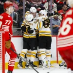 Mar 21, 2026; Detroit, Michigan, USA; Boston Bruins defenseman Nikita Zadorov (91) celebrates with right wing David Pastrnak (88) and center Marat Khusnutdinov (92) after scoring a goal in the third period against the Detroit Red Wings at Little Caesars Arena. Mandatory Credit: Brian Bradshaw Sevald-Imagn Images