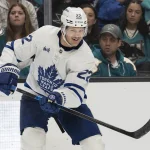 Apr 2, 2026; San Jose, California, USA; Toronto Maple Leafs defenseman Jake McCabe (22) reacts after passing the puck during the third period against the San Jose Sharks at SAP Center at San Jose.