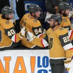 Sep 28, 2022; Las Vegas, Nevada, USA; Vegas Golden Knights center Michael Amadio (22) celebrates with Vegas Golden Knights defenseman Lukas Cormier (40) after scoring a second period goal against the Colorado Avalanche during a preseason game at T-Mobile Arena. Mandatory Credit: Stephen R. Sylvanie-USA TODAY Sports