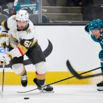 Sep 26, 2025; San Jose, California, USA; Vegas Golden Knights defenseman Lukas Cormier (51) plays the puck against San Jose Sharks forward Ty Dellandrea (10) during the first period at SAP Center at San Jose.