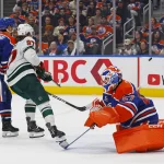 Oct 20, 2026; Edmonton, Alberta, CAN; Edmonton Oilers goaltender Devon Levi (27) makes a save on Minnesota Wild forward Kirill Kaprizov (97) during the second period at Rogers Place. Mandatory Credit: Perry Nelson-Imagn Images