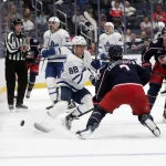 Oct 20, 2026; Columbus, Ohio, USA; Toronto Maple Leafs right wing William Nylander (88) flips there puck over the stick of Columbus Blue Jackets defenseman Jake Christiansen (2) during the third period at Nationwide Arena.
