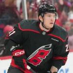 Jan 19, 2026; Raleigh, North Carolina, USA; Carolina Hurricanes defenseman Alexander Nikishin (21) skates during the warmups before the game against the Buffalo Sabres at Lenovo Center.