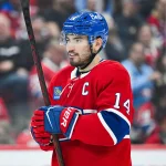 Oct 13, 2026; Montreal, Quebec, CAN; Montreal Canadiens center Nick Suzuki (14) looks on against the Buffalo Sabres during the second period at Bell Centre.