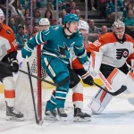 Two NHL forwards up for grabs on waivers as Flyers and Blues make moves Mar 21, 2026; San Jose, California, USA; San Jose Sharks center Macklin Celebrini (71) stands in the goal crease against Philadelphia Flyers defenseman Jamie Drysdale (9), goaltender Dan Vladar (80) and left wing Garrett Wilson (10) during the second period at SAP Center at San Jose. Mandatory Credit: Robert Edwards-Imagn Images