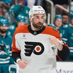 Mar 21, 2026; San Jose, California, USA; Philadelphia Flyers left wing Garrett Wilson (10) prepares to fight against San Jose Sharks right wing Ryan Reaves (not pictured) during the first period at SAP Center at San Jose.