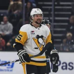 Oct 19, 2026; Salt Lake City, Utah, USA; Pittsburgh Penguins defenseman Erik Karlsson (65) celebrates after scoring a power play goal against the Utah Mammoth during the first period at Delta Center.