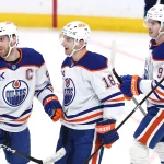 Dec 29, 2025; Winnipeg, Manitoba, CAN; Edmonton Oilers left wing Zach Hyman (18) celebrates an empty net goal against the Winnipeg Jets with Connor McDavid (97) and Ryan Nugent-Hopkins (93) in the third period at Canada Life Centre.