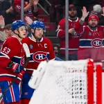 Mar 14, 2026; Montreal, Quebec, CAN; Montreal Canadiens center Nick Suzuki (14) celebrates with right wing Ivan Demidov (93) his goal against the San Jose Sharks during the second period at Bell Centre.