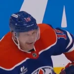 Zach Hyman winks at teammate after drawing a penalty on Hurricanes' Sean Walker