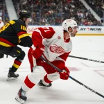 Oct 22, 2026; Vancouver, British Columbia, CAN; Detroit Red Wings forward Dylan Larkin (71) skates against the Vancouver Canucks in the second period at Rogers Arena.