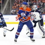 Oct 21, 2023; Edmonton, Alberta, CAN; Edmonton Oilers forward Connor McDavid (97) looks for a pass in front of Winnipeg Jets goaltender Connor Hellebuyck (37) during the first period at Rogers Place. Mandatory Credit: Perry Nelson-USA TODAY Sports