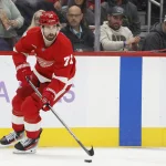 Oct 15, 2026; Detroit, Michigan, USA; Detroit Red Wings center Dylan Larkin (71) skates with the puck in the second period against the Philadelphia Flyers at Little Caesars Arena.
