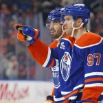 Oct 22, 2026; Edmonton, Alberta, CAN; Edmonton Oilers forward Connor McDavid (97) celebrates after scoring a goal against the Carolina Hurricanes during the third period at Rogers Place.