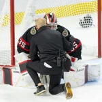 Oct 21, 2026; Ottawa, Ontario, CAN; Ottawa Senators Athletic Therapist Domenic Nicoletta checks on goalie Linus Ullmark (35) after he sustained an injury in the third period at the Canadian Tire Centre.