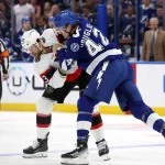 Oct 9, 2025; Tampa, Florida, USA;Tampa Bay Lightning defenseman Darren Raddysh (43) and Ottawa Senators left wing Kurtis MacDermid (23) fight during the first period at Benchmark International Arena.
