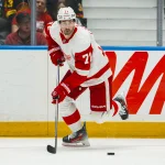 Oct 22, 2026; Vancouver, British Columbia, CAN; Detroit Red Wings forward Dylan Larkin (71) handles the puck against the Vancouver Canucks in the first period at Rogers Arena.