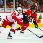 Oct 24, 2026; Calgary, Alberta, CAN; Detroit Red Wings center Dylan Larkin (71) controls the puck against the Calgary Flames during the second period at Scotiabank Saddledome.