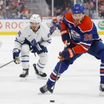 Oct 24, 2026; Edmonton, Alberta, CAN; Edmonton Oilers forward Leon Draisaitl (29) looks to make a pass in front of Toronto Maple Leafs forward Jack Roslovic (96) during the third period at Rogers Place. Mandatory Credit: Perry Nelson-Imagn Images