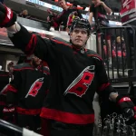 Nov 28, 2025; Raleigh, North Carolina, USA; Carolina Hurricanes defenseman Alexander Nikishin (21) comes out of the locker room before the start of the warmups Winnipeg Jets at Lenovo Center.