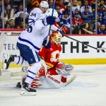 Embarrassing scene unfolds in the stands at the Saddledome during Flames-Maple Leafs game Oct 26, 2026; Calgary, Alberta, CAN; Calgary Flames goaltender Devin Cooley (1) makes a save against the Toronto Maple Leafs during the third period at Scotiabank Saddledome. Mandatory Credit: Sergei Belski-Imagn Images