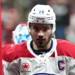 23 mai 2026 ; Raleigh, Caroline du Nord, États-Unis ; le joueur de centre des Canadiens de Montréal, Nick Suzuki (14), quitte la glace après l'échauffement précédant un match contre les Hurricanes de la Caroline, lors de la deuxième rencontre de la finale de l'Association de l'Est des séries éliminatoires de la Coupe Stanley 2026, au Lenovo Center.