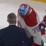 Le gardien du Canadien de Montréal, Jakub Dobes, et l'entraîneur-chef Martin St-Louis.