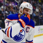 Oct 17, 2026; Salt Lake City, Utah, USA; Edmonton Oilers center Connor McDavid (97) silences the crowd after his goal during third period against the Utah Mammoth at Delta Center.
