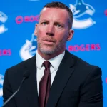 Jun 4, 2026; Vancouver, BC, CANADA; General manager Ryan Johnson speaks in a press conference where the Vancouver Canucks introduce Manny Malhotra as their new head coach at Rogers Arena