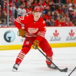 Nov 9, 2025; Detroit, Michigan, USA; Detroit Red Wings defenseman Simon Edvinsson (77) handles the puck during the second period against the Chicago Blackhawks at Little Caesars Arena.