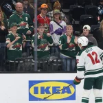 Oct 27, 2026; Salt Lake City, Utah, USA; Minnesota Wild left wing Matt Boldy (12) interacts with fans before a game Utah Mammoth at Delta Center.