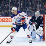 Sep 22, 2026; Winnipeg, Manitoba, CAN; Edmonton Oilers forward Zach Hyman (18) screens Winnipeg Jets goalie Domenic DiVincentiis (50) during the first period at Canada Life Centre.